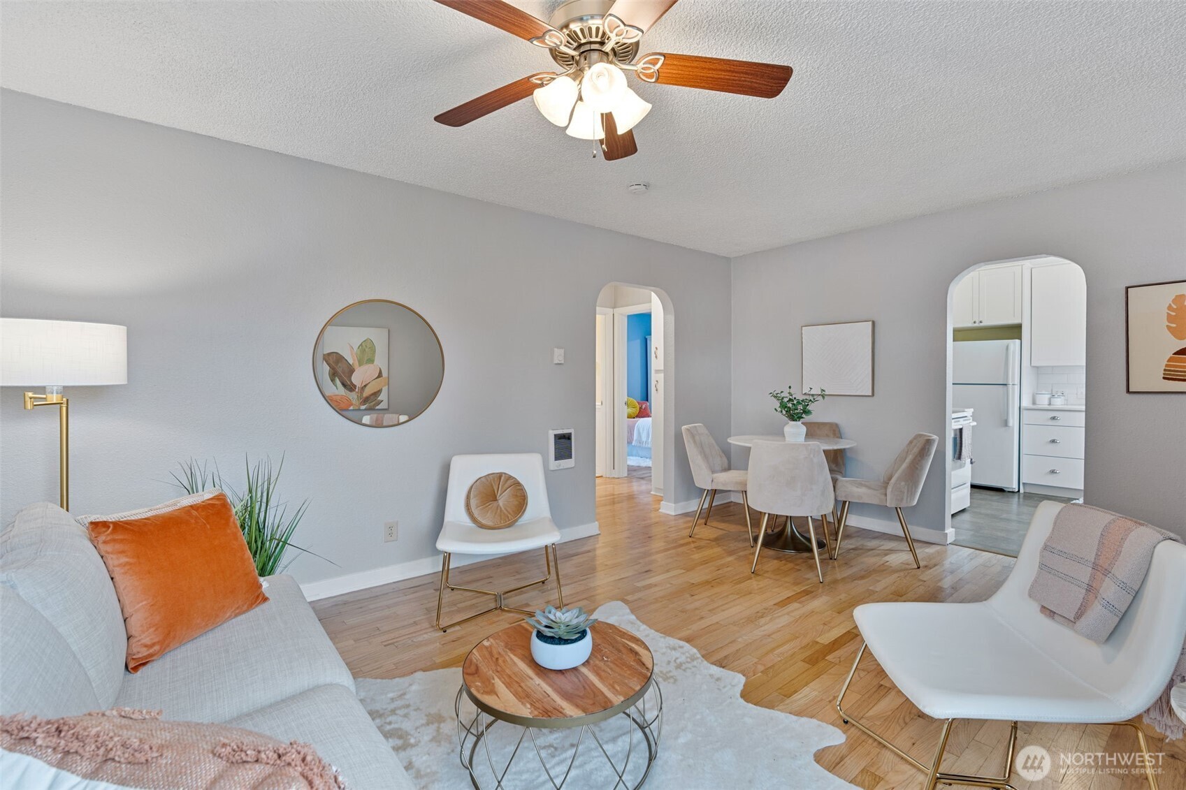 1027 South Rochester Street Tacoma, WA 98465 - Photo 8 of 29 a living room with furniture a rug and a lamp