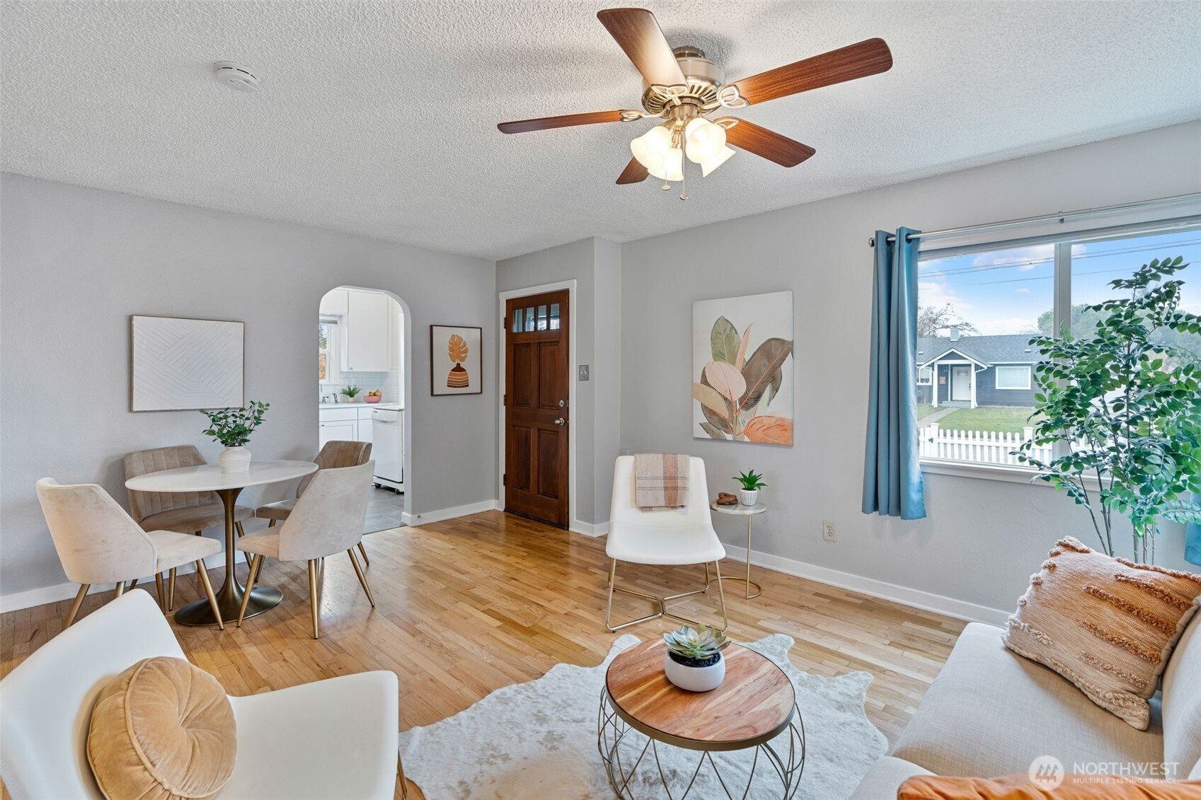 1027 South Rochester Street Tacoma, WA 98465 - Photo 9 of 29 a living room with furniture and a potted plant