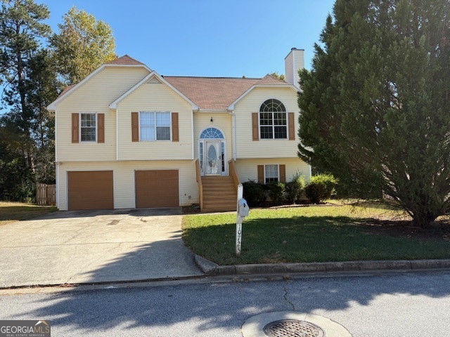 10725 Barberry Drive Hampton, GA 30228 - Photo 1 of 18 a front view of a house with a yard