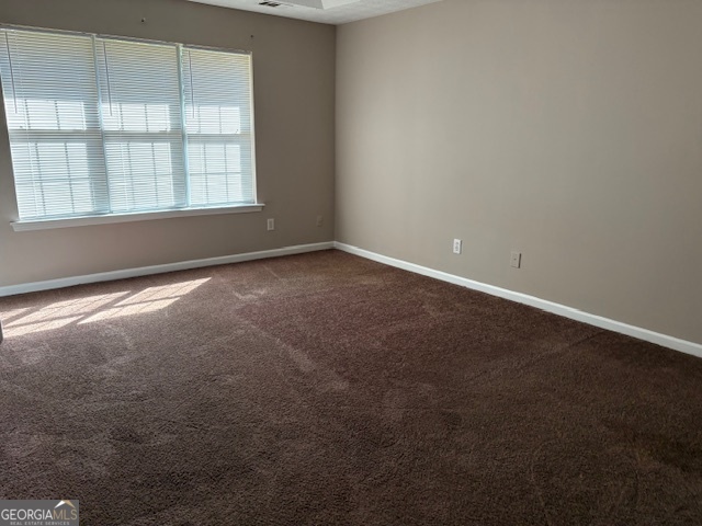 10725 Barberry Drive Hampton, GA 30228 - Photo 13 of 18 an empty room with a window