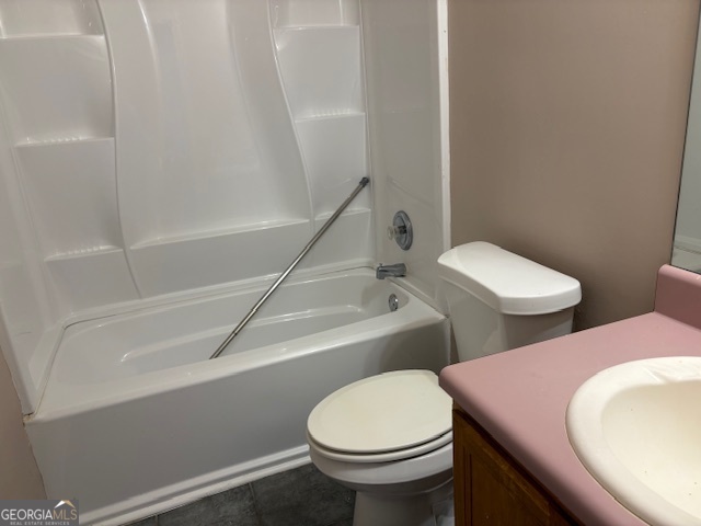 10725 Barberry Drive Hampton, GA 30228 - Photo 17 of 18 a bathroom with a toilet a sink and bathtub
