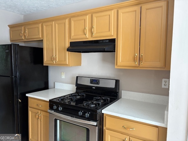 10725 Barberry Drive Hampton, GA 30228 - Photo 7 of 18 a kitchen with granite countertop cabinets and black appliances