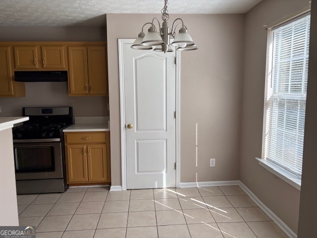 10725 Barberry Drive Hampton, GA 30228 - Photo 9 of 18 a kitchen with a refrigerator a stove top oven and cabinets