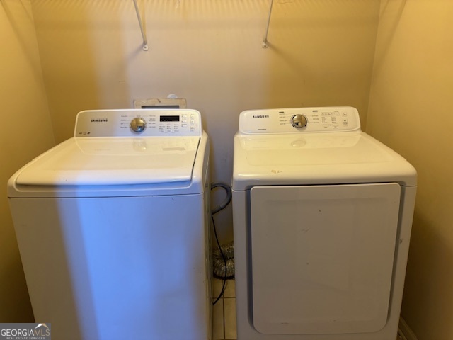 10725 Barberry Drive Hampton, GA 30228 - Photo 10 of 18 a utility room with dryer and washer