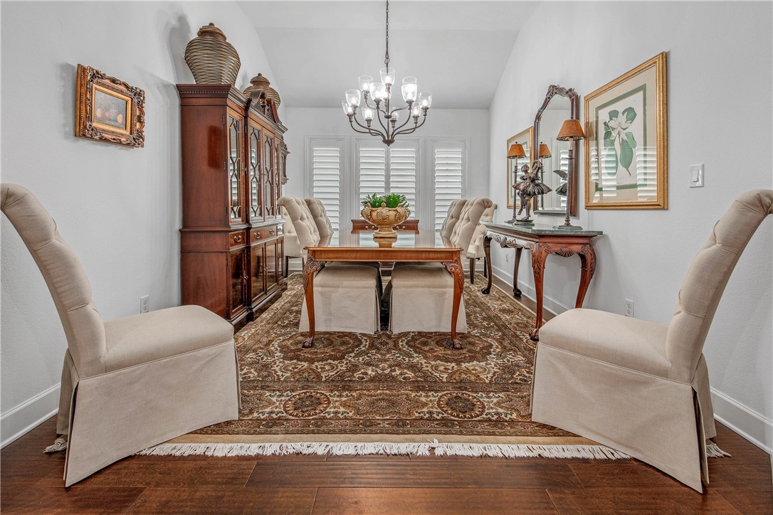 4001 Dunlap Loop College Station, TX 77845 - Photo 16 of 50 a living room with fireplace furniture and a chandelier