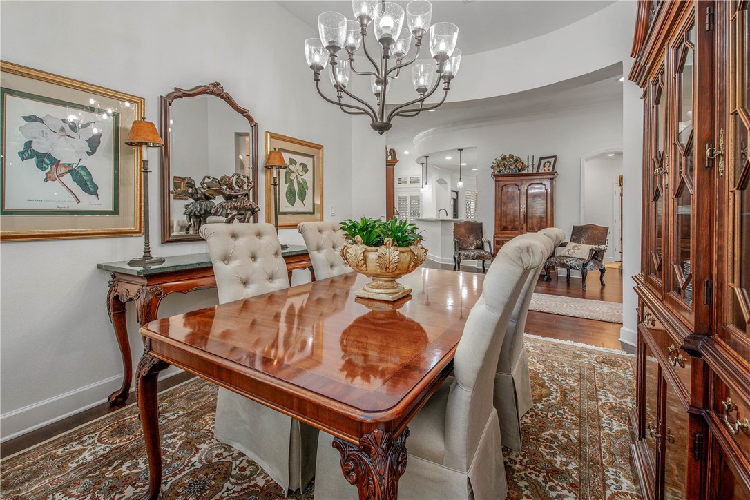 4001 Dunlap Loop College Station, TX 77845 - Photo 17 of 50 a dining room with furniture a chandelier and wooden floor