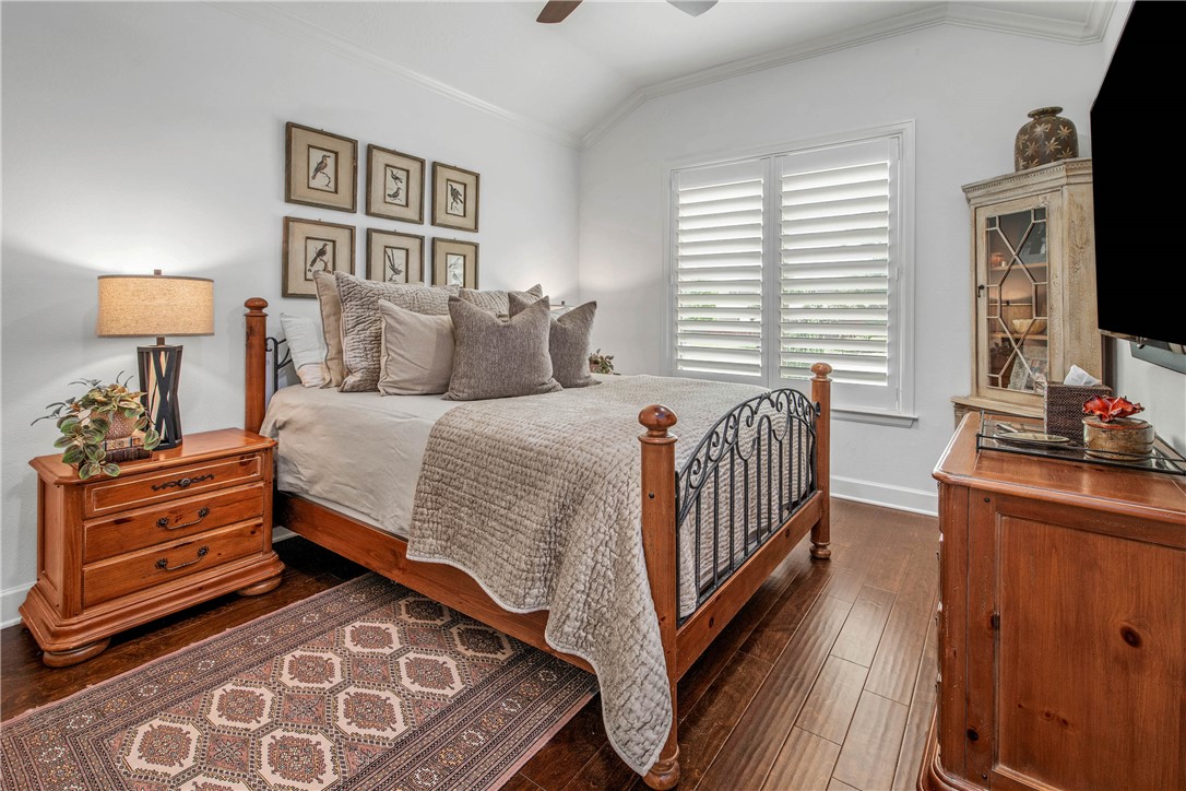 4001 Dunlap Loop College Station, TX 77845 - Photo 22 of 50 a bedroom with a bed and a flat tv screen on dresser