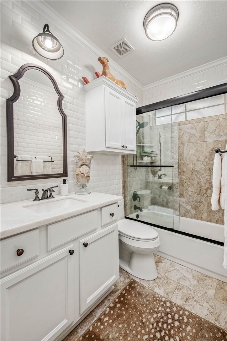 4001 Dunlap Loop College Station, TX 77845 - Photo 23 of 50 a bathroom with a sink a toilet and a mirror
