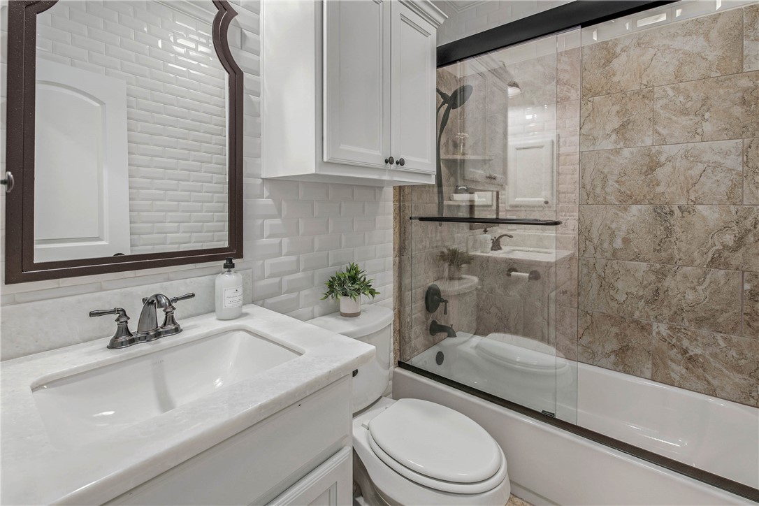 4001 Dunlap Loop College Station, TX 77845 - Photo 27 of 50 a bathroom with a sink a toilet and shower