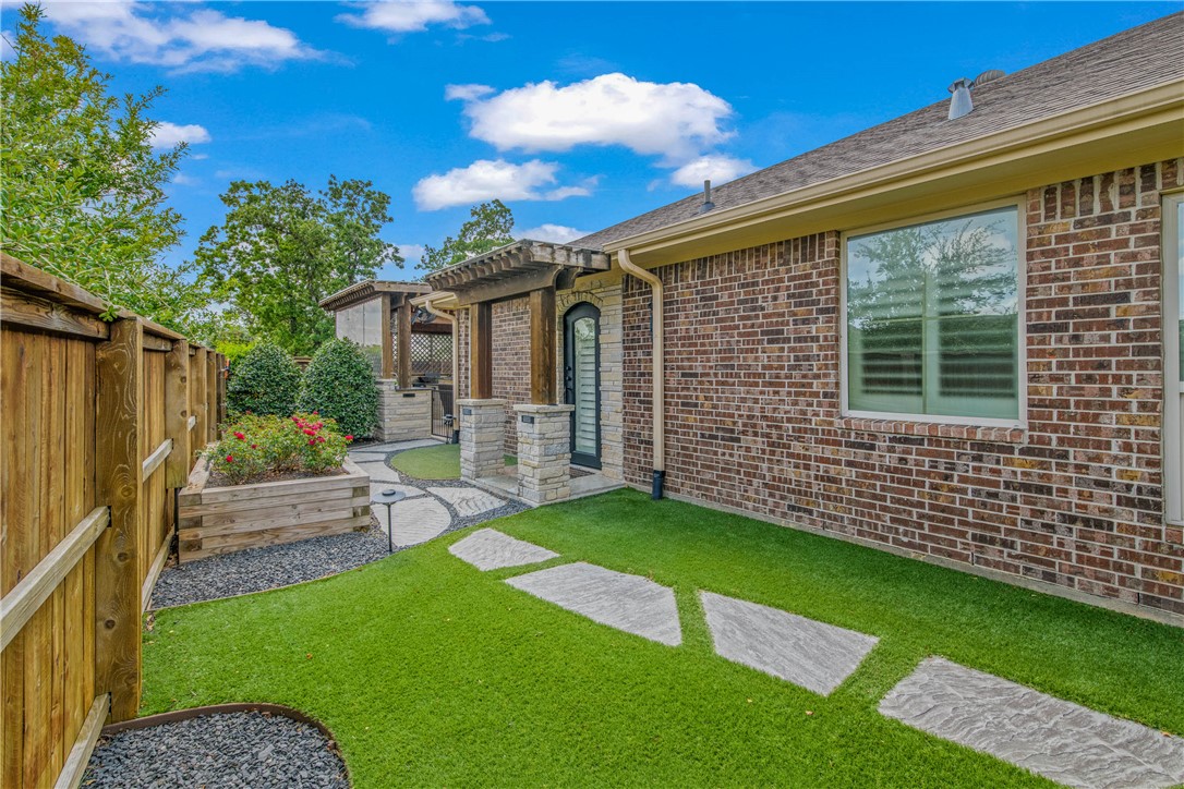 4001 Dunlap Loop College Station, TX 77845 - Photo 46 of 50 a front view of a house with a garden
