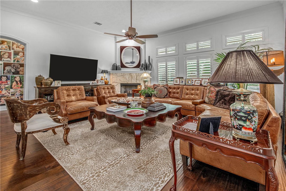4001 Dunlap Loop College Station, TX 77845 - Photo 9 of 50 a living room with furniture a flat screen tv and a fireplace