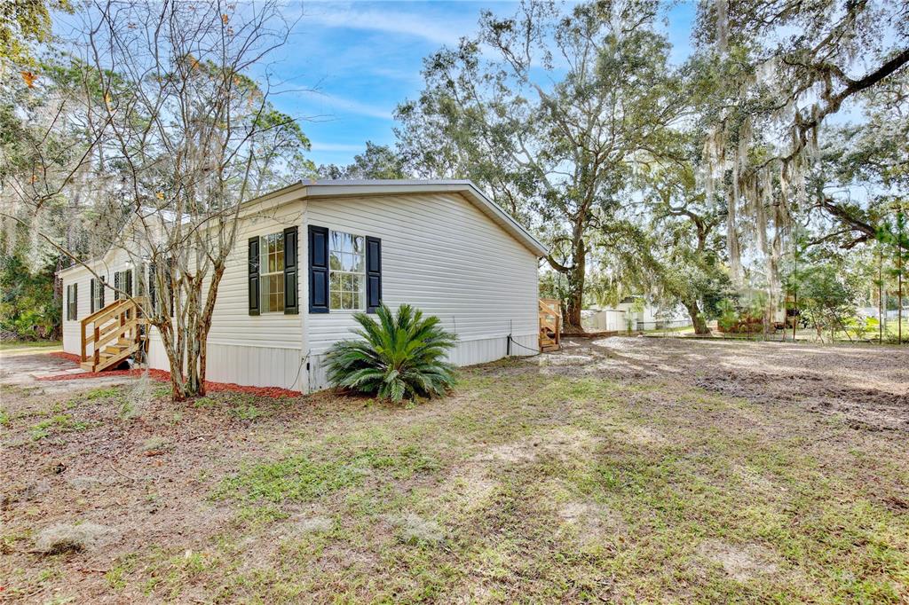 15330 Apache Pass Eustis, FL 32726 - Photo 11 of 44 a front view of a house with a yard