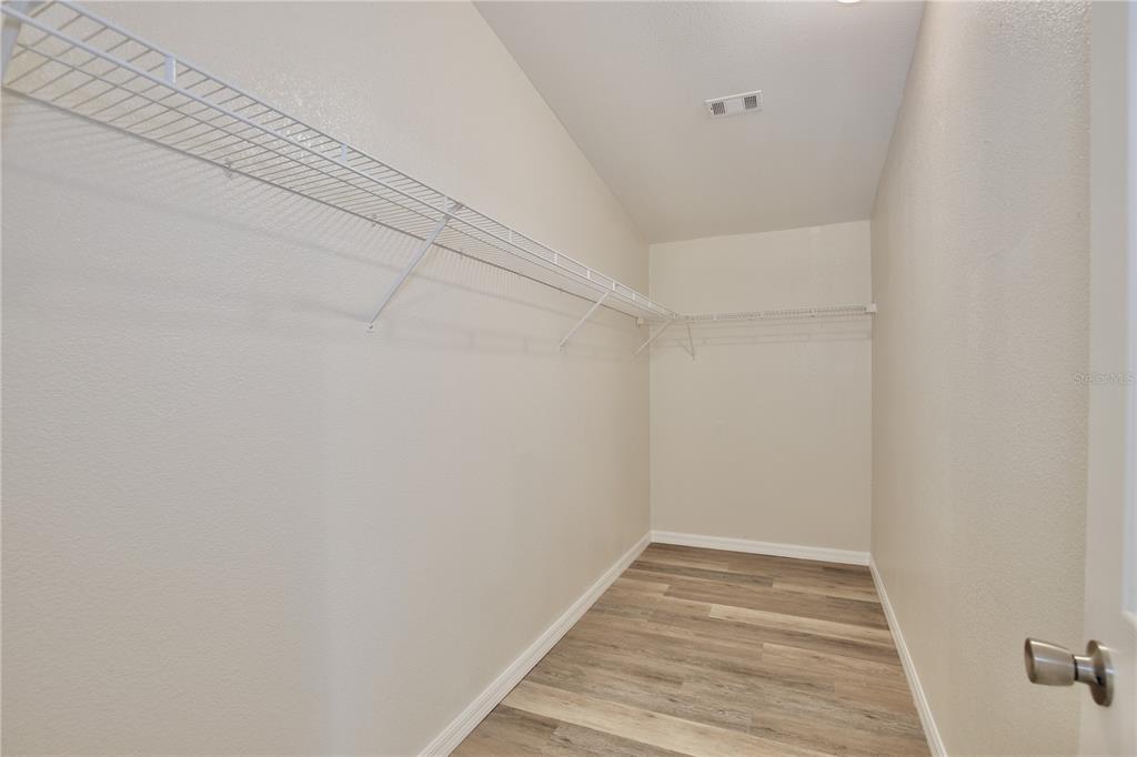 15330 Apache Pass Eustis, FL 32726 - Photo 13 of 44 a view of a room with wooden floor