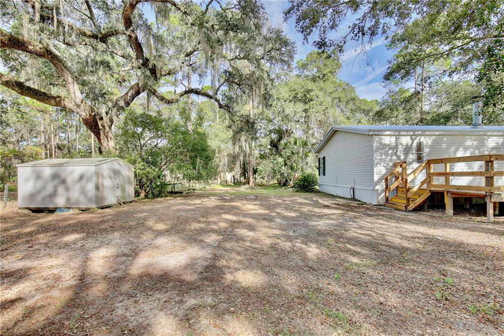 15330 Apache Pass Eustis, FL 32726 - Photo 33 of 44 a view of a outdoor space with car parked