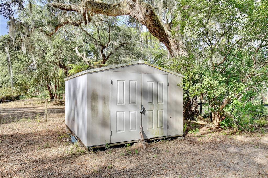 15330 Apache Pass Eustis, FL 32726 - Photo 35 of 44 a backyard of a house with a yard and staircase