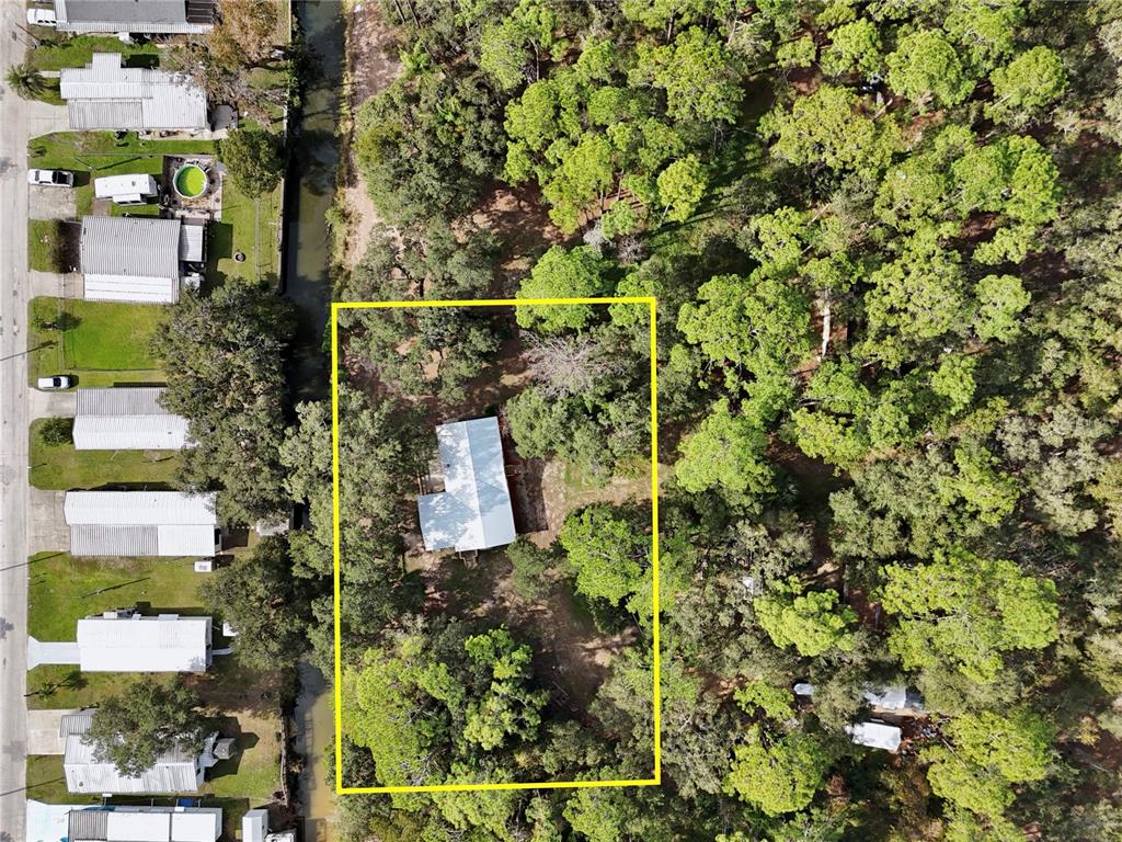 15330 Apache Pass Eustis, FL 32726 - Photo 38 of 44 an aerial view of residential house with outdoor space and trees