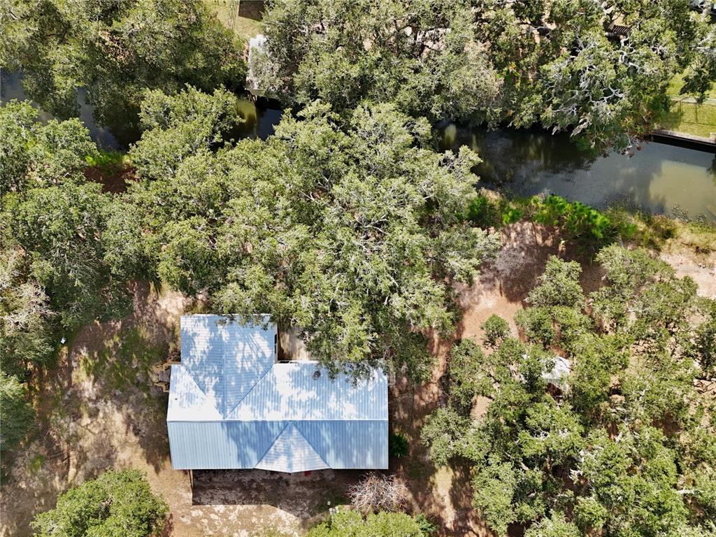 15330 Apache Pass Eustis, FL 32726 - Photo 39 of 44 an aerial view of a house with a yard and large trees