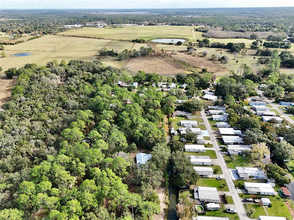 15330 Apache Pass Eustis, FL 32726 - Photo 42 of 44 an aerial view of residential building and lake view