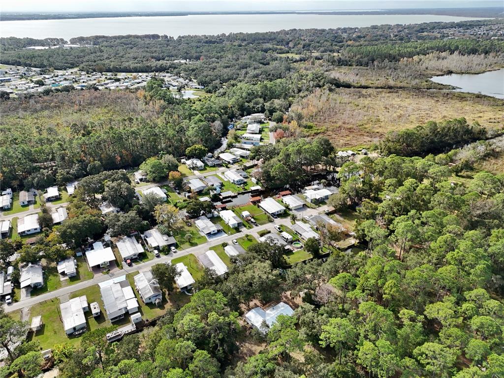 15330 Apache Pass Eustis, FL 32726 - Photo 44 of 44 an aerial view of house with yard and mountain view in back