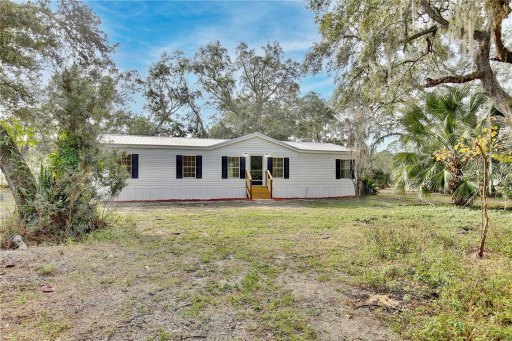 15330 Apache Pass Eustis, FL 32726 - Photo 8 of 44 a view of a house with a yard