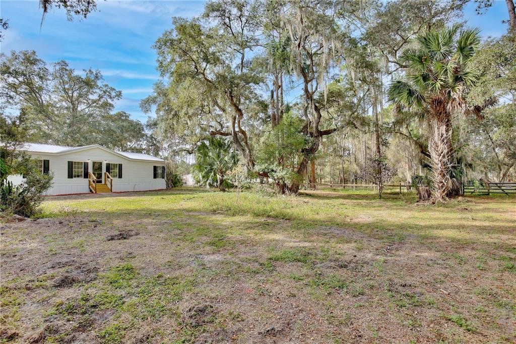 15330 Apache Pass Eustis, FL 32726 - Photo 10 of 44 a view of a house with a yard