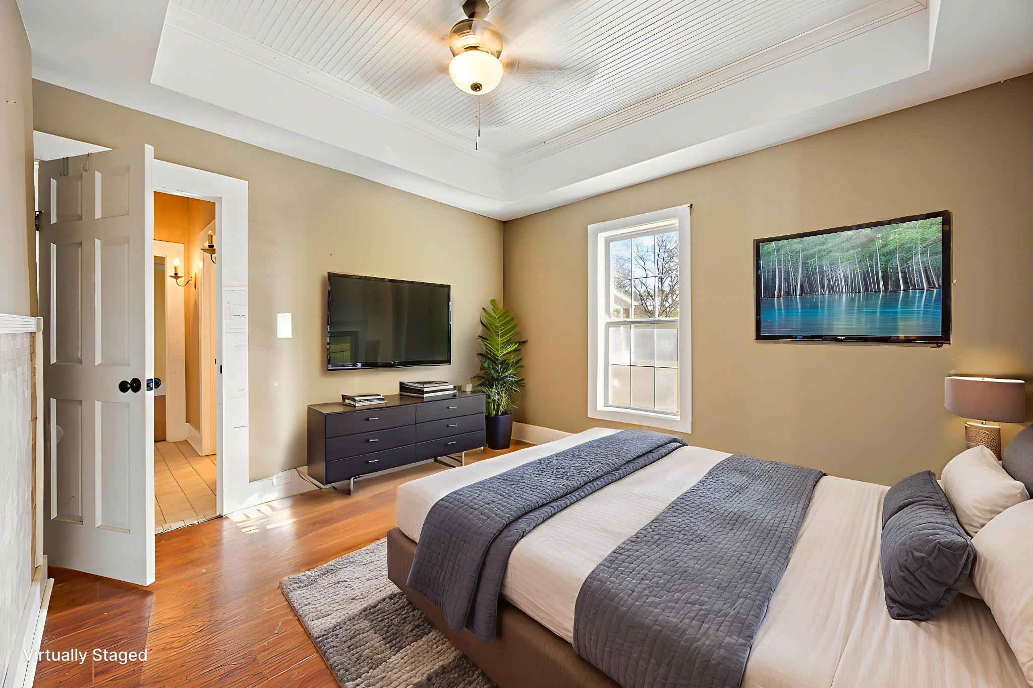 801 South High Street Winchester, TN 37398 - Photo 11 of 49 a bedroom with a bed a flat screen tv and a chandelier