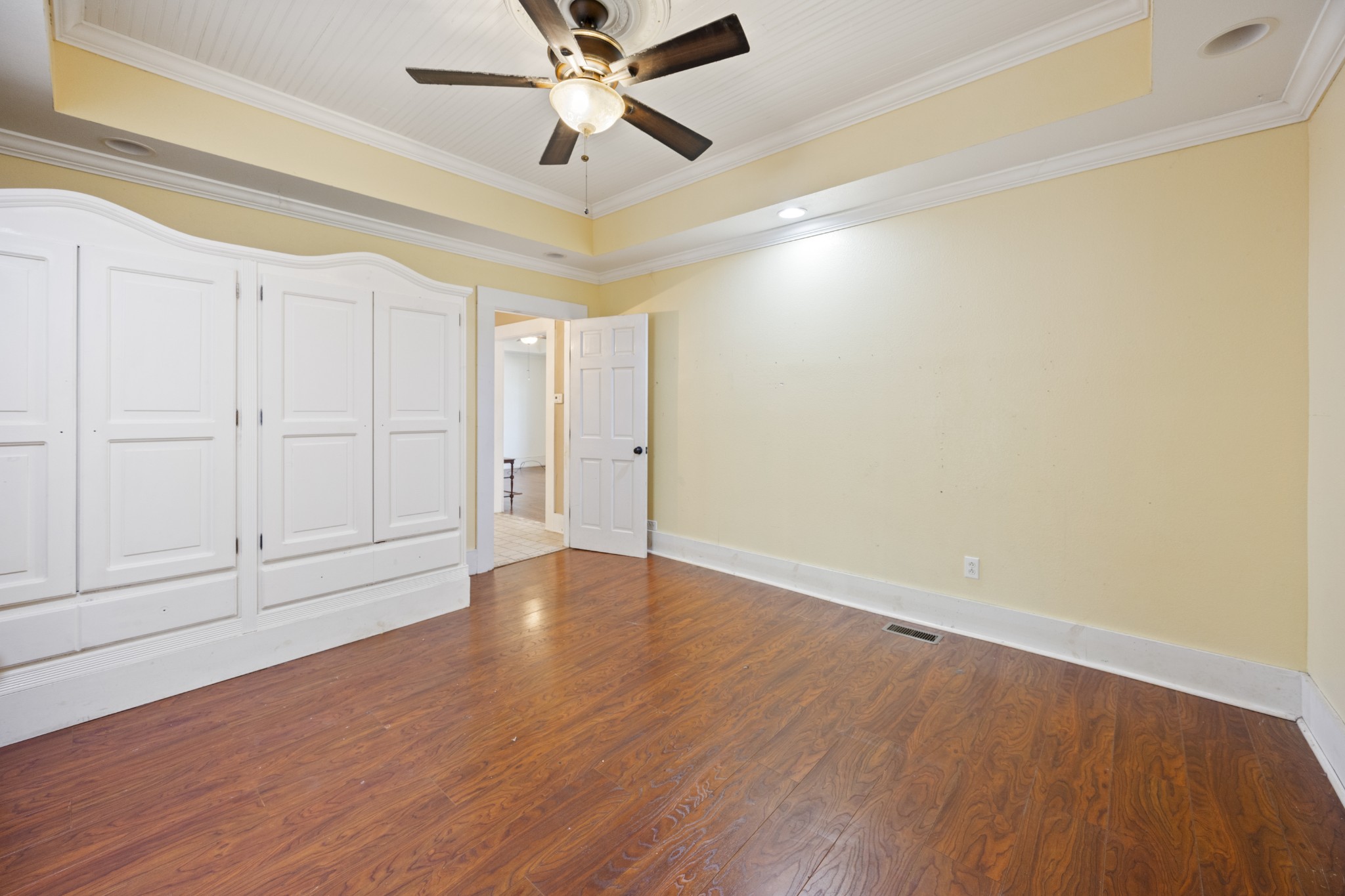 801 South High Street Winchester, TN 37398 - Photo 13 of 49 an empty room with wooden floor and windows