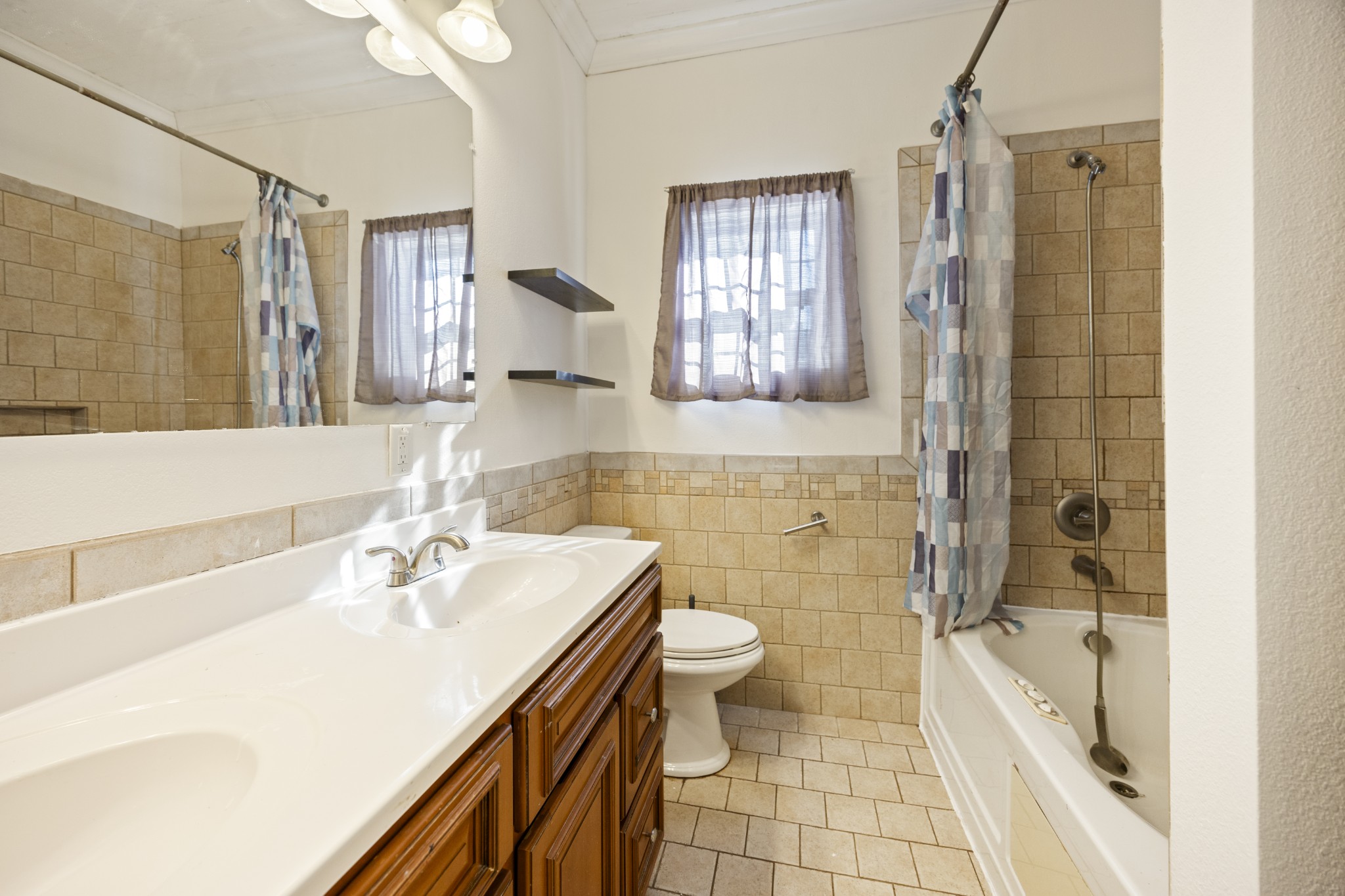 801 South High Street Winchester, TN 37398 - Photo 21 of 49 a bathroom with a bathtub shower sink mirror and toilet