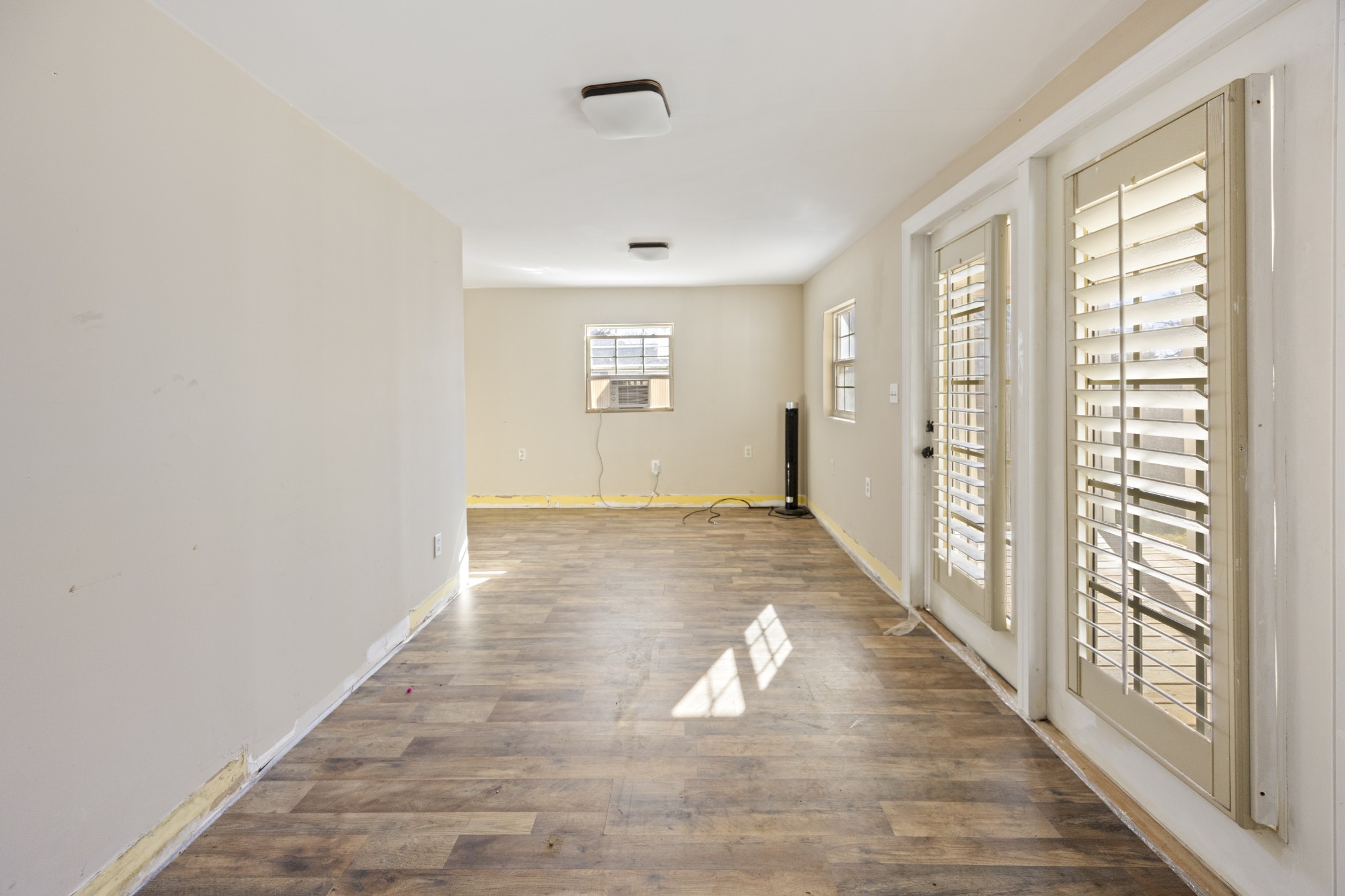 801 South High Street Winchester, TN 37398 - Photo 24 of 49 a view of an empty room with wooden floor and a window