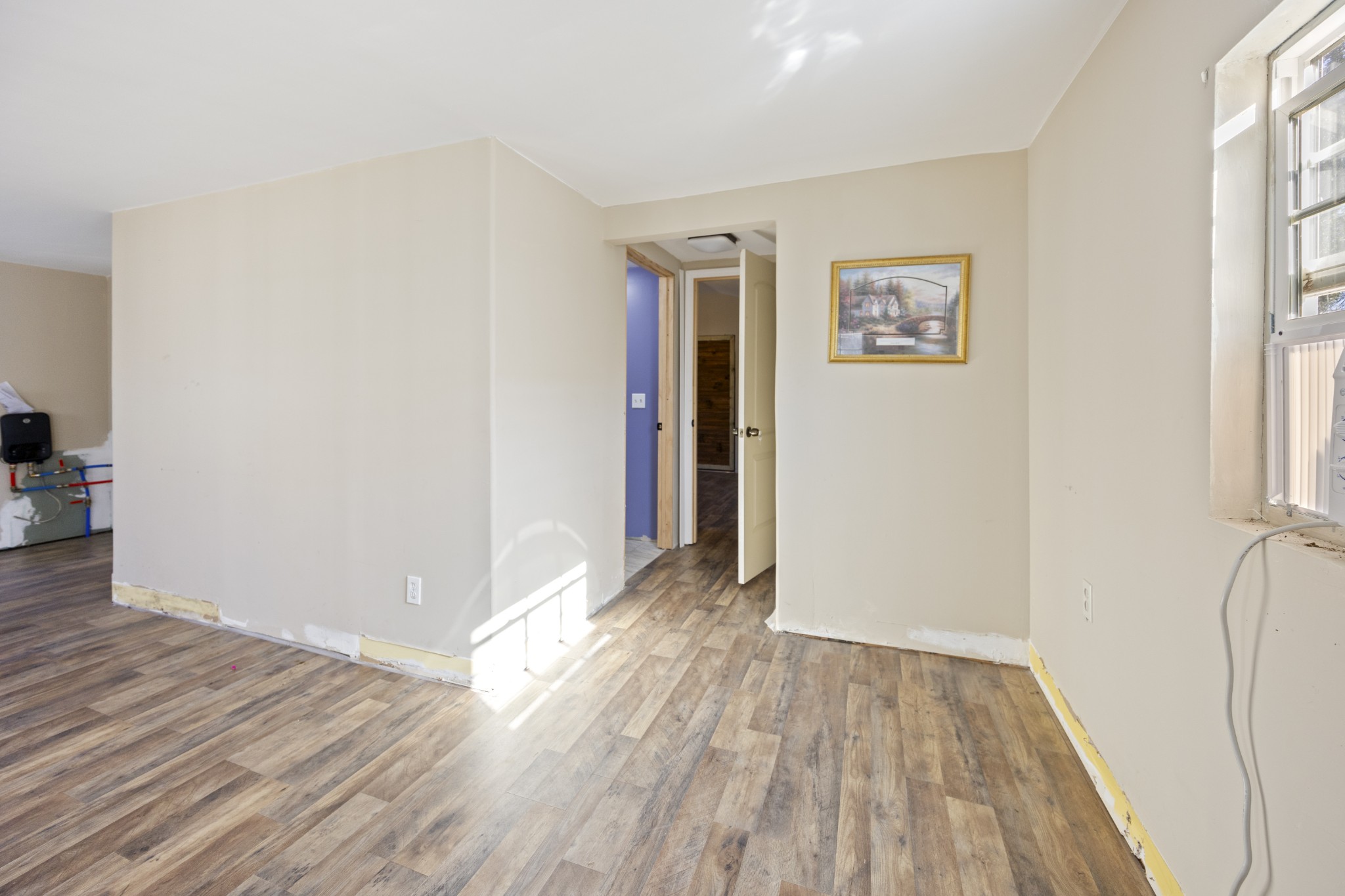 801 South High Street Winchester, TN 37398 - Photo 26 of 49 an empty room with wooden floor and windows
