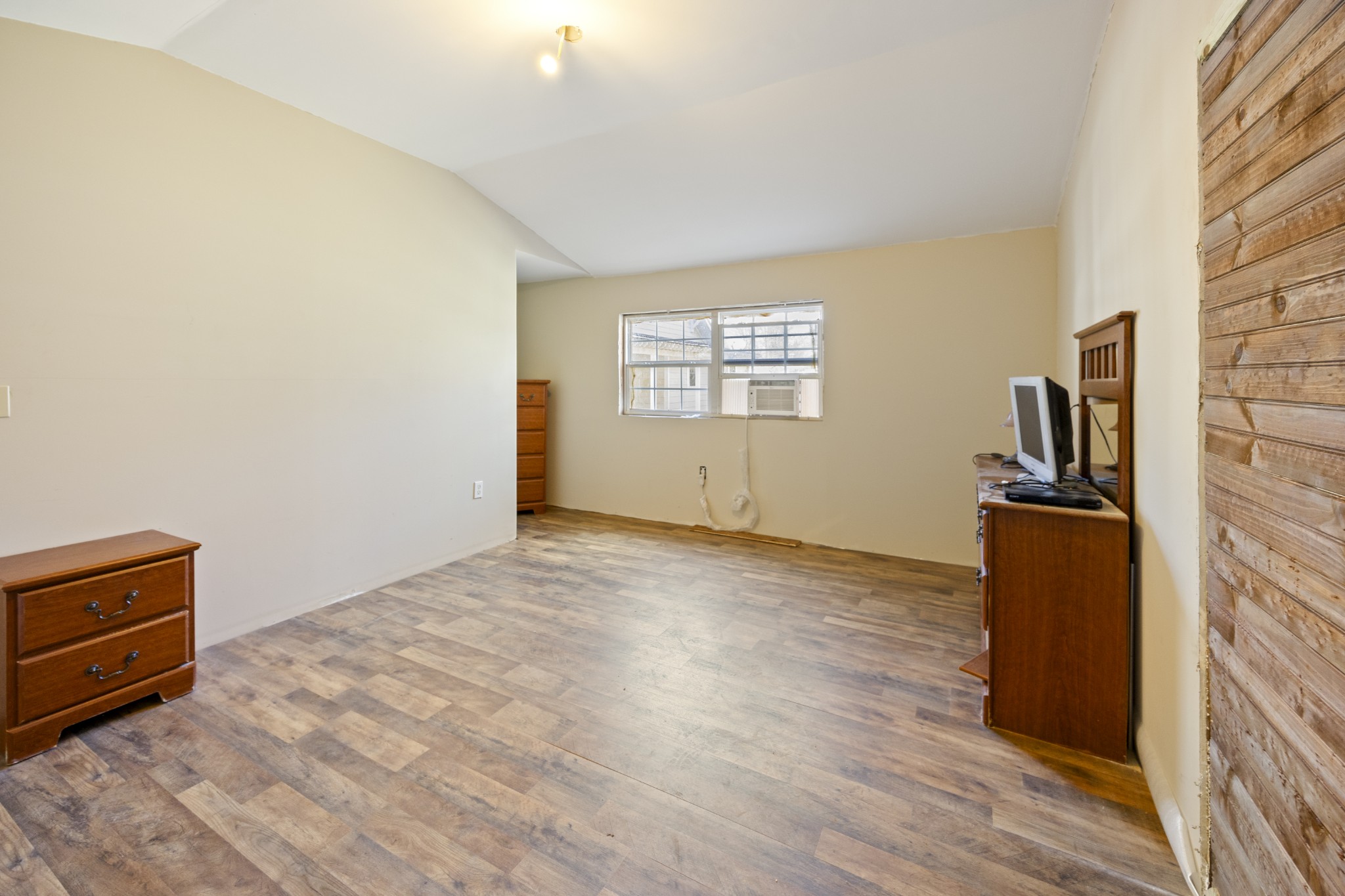 801 South High Street Winchester, TN 37398 - Photo 29 of 49 a view of an empty room with wooden floor and a window