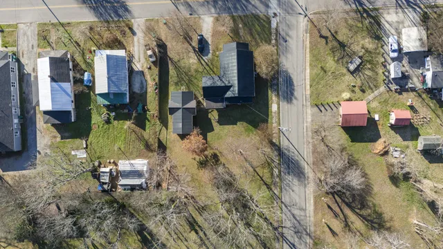 a backyard of apartments with large trees