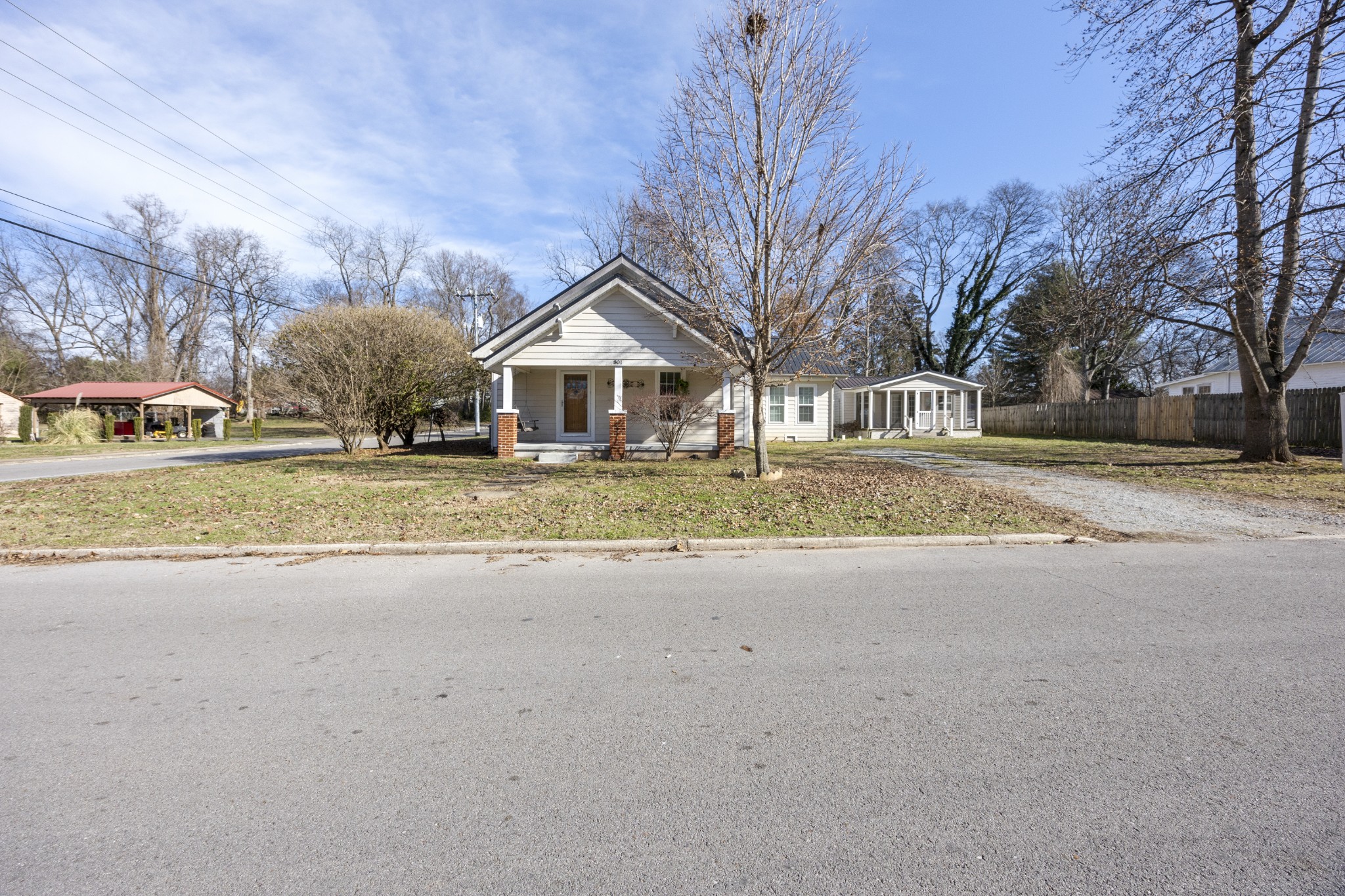 801 South High Street Winchester, TN 37398 - Photo 37 of 49 a front view of a house with a yard and garage
