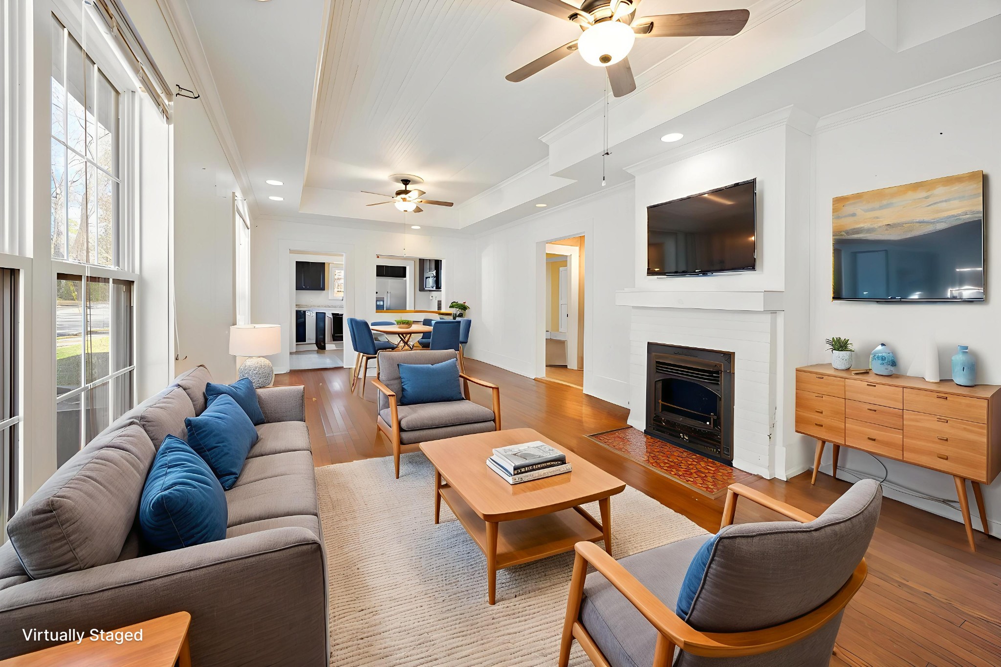 801 South High Street Winchester, TN 37398 - Photo 5 of 49 a living room with furniture a flat screen tv and a fireplace