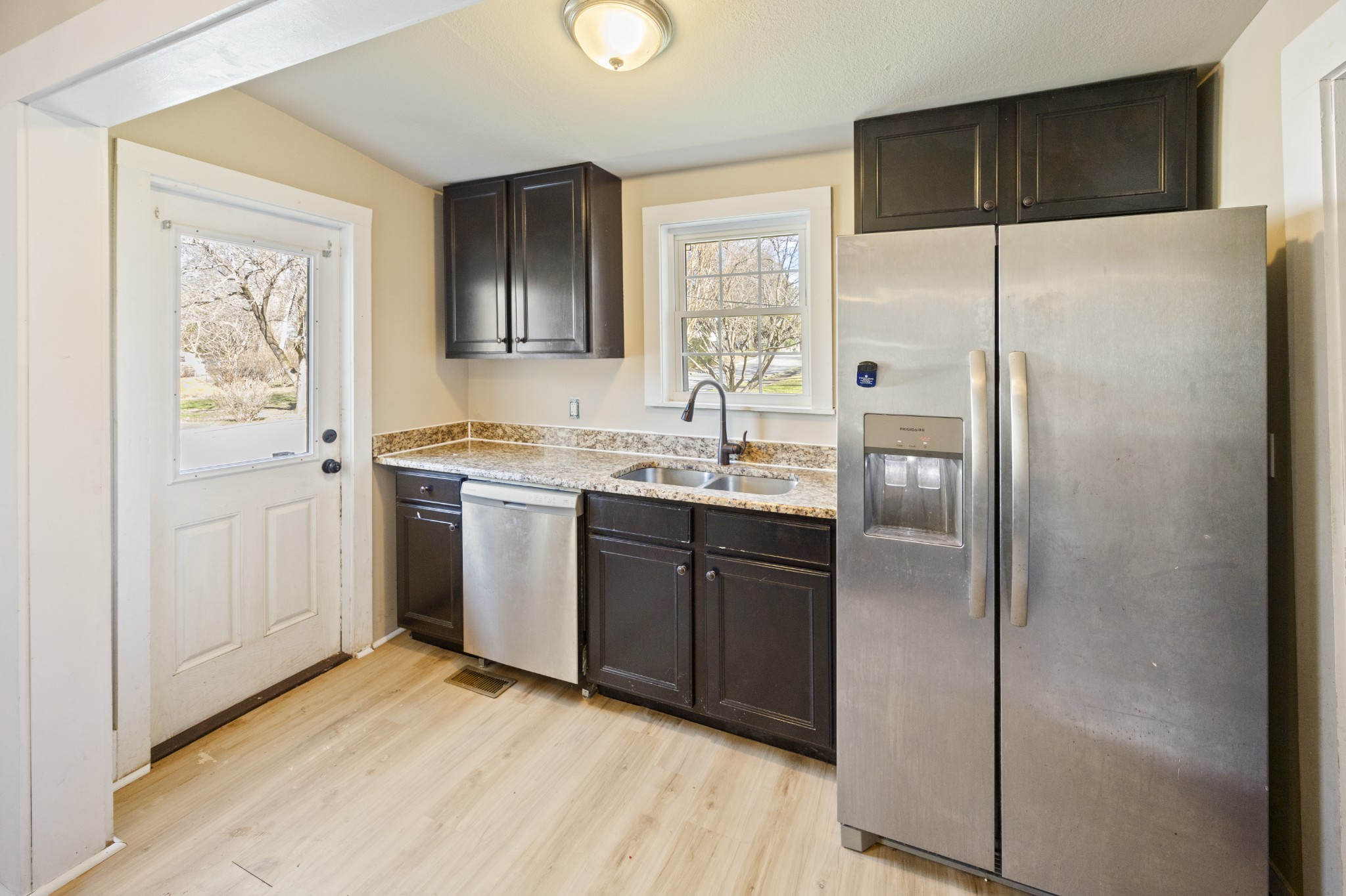 801 South High Street Winchester, TN 37398 - Photo 8 of 49 a kitchen with a refrigerator sink and cabinets