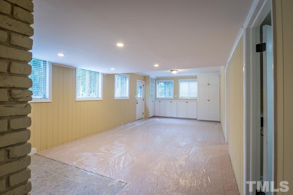 4220 Rowan Street Raleigh, NC 27609 - Photo 16 of 24 a view of empty room with windows