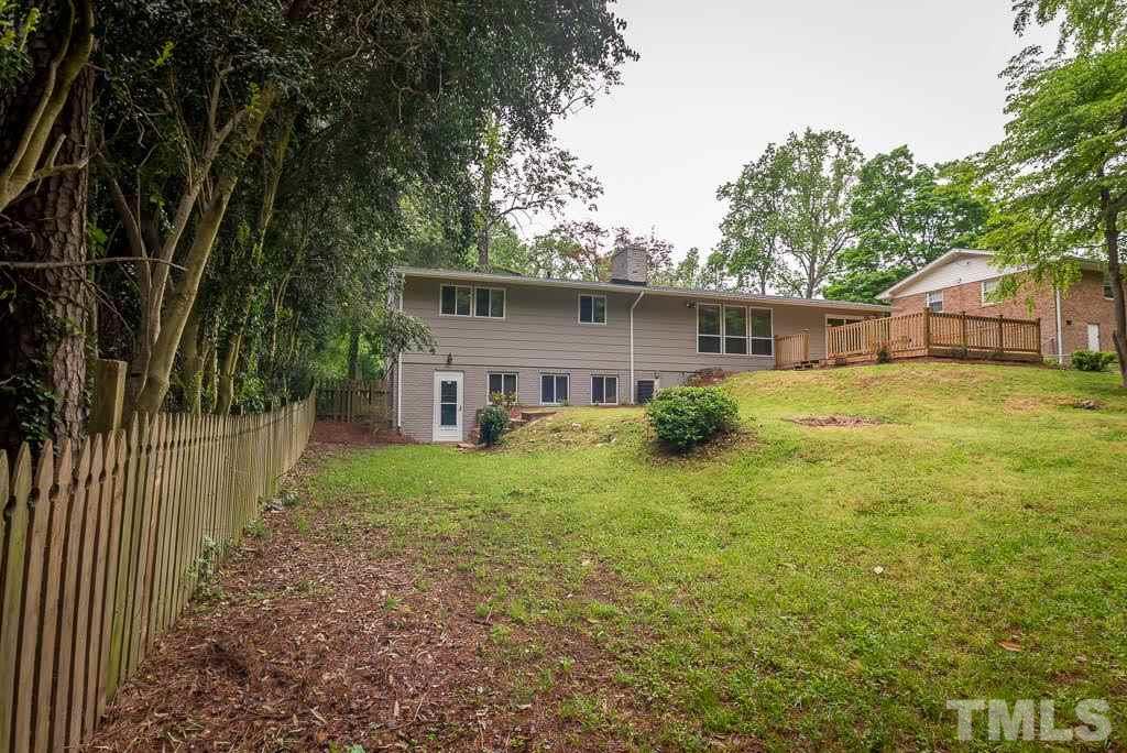 4220 Rowan Street Raleigh, NC 27609 - Photo 3 of 24 a view of a house with backyard and trees