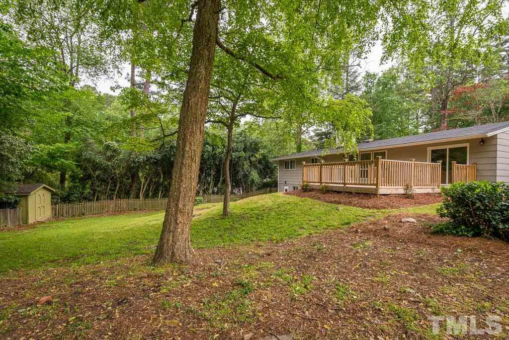 4220 Rowan Street Raleigh, NC 27609 - Photo 21 of 24 a view of a house with a backyard