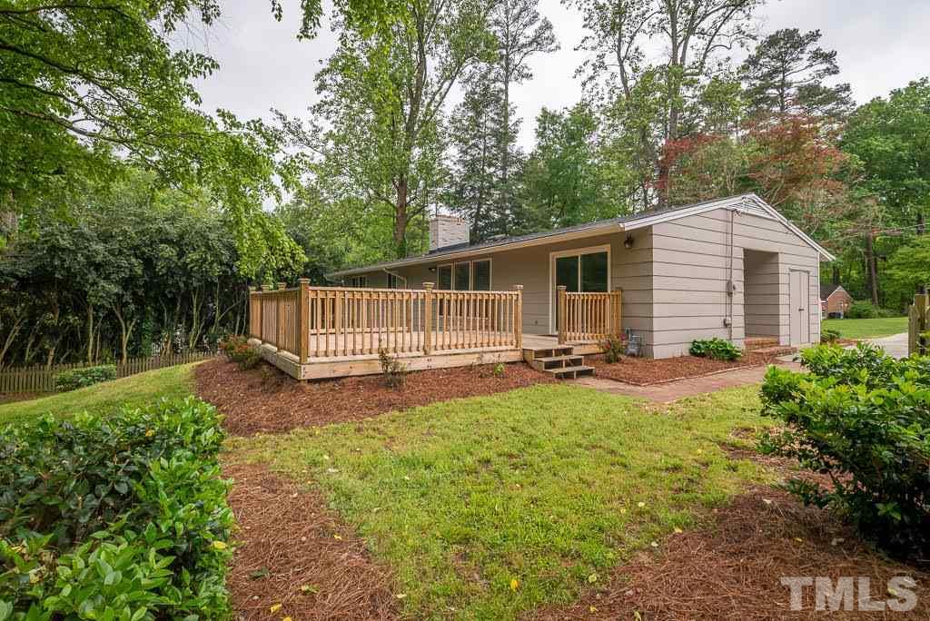4220 Rowan Street Raleigh, NC 27609 - Photo 22 of 24 a view of a house with backyard and garden