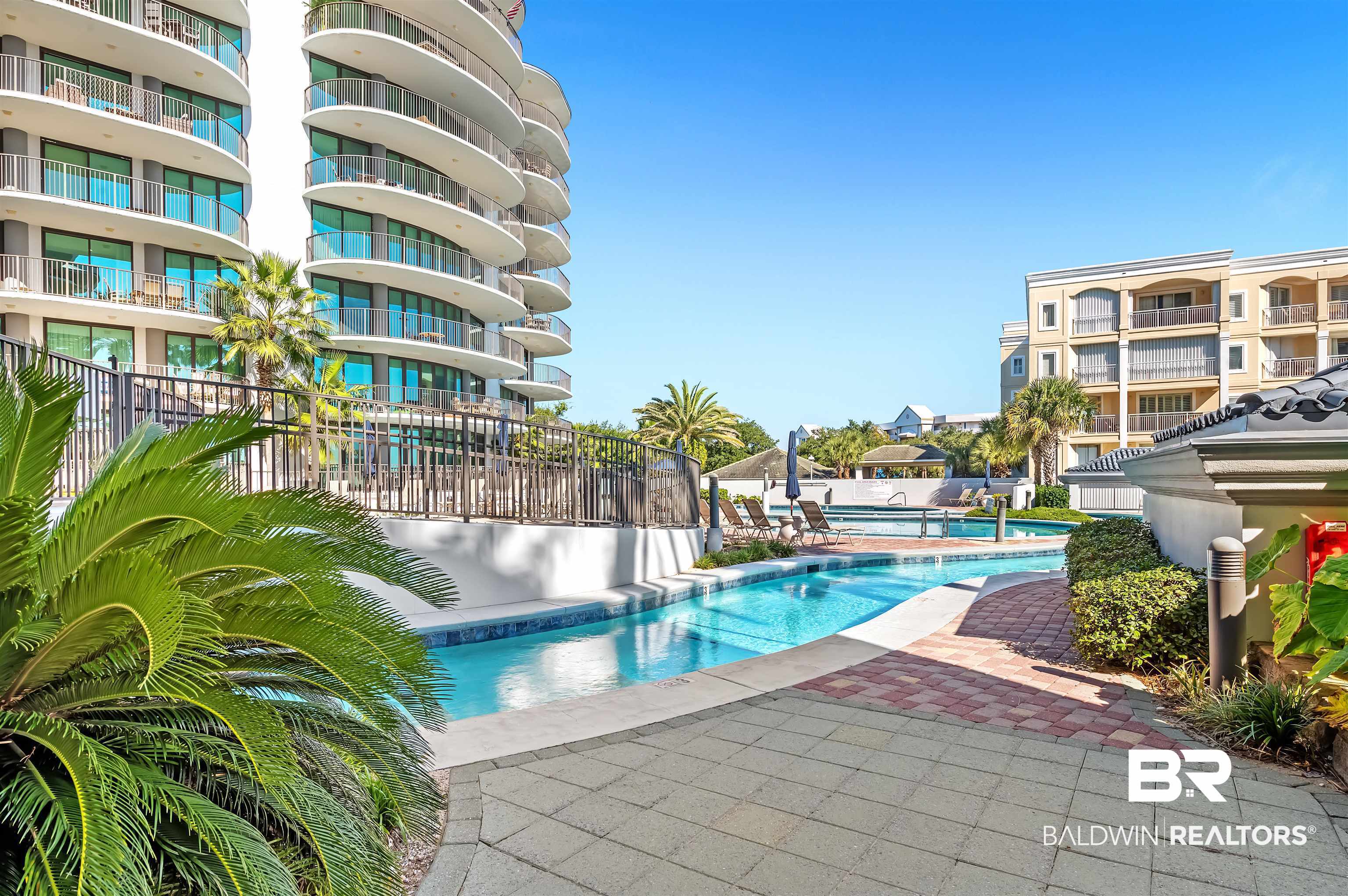 27582 Canal Road, Unit 2507 Orange Beach, AL 36561 - Photo 70 of 75 Community pool featuring a patio