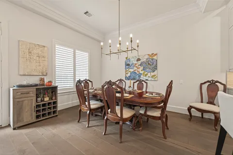 a view of a dining room with furniture and window