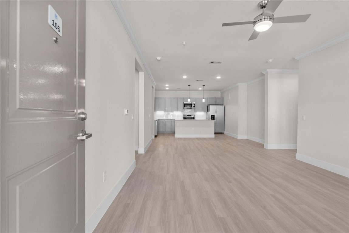 540 Hobbs Road, Unit B1 League City, TX 77573 - Photo 2 of 33 a view of a kitchen with a sink and wooden floor