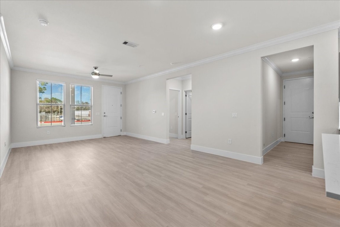 540 Hobbs Road, Unit B1 League City, TX 77573 - Photo 3 of 33 an empty room with wooden floor and windows