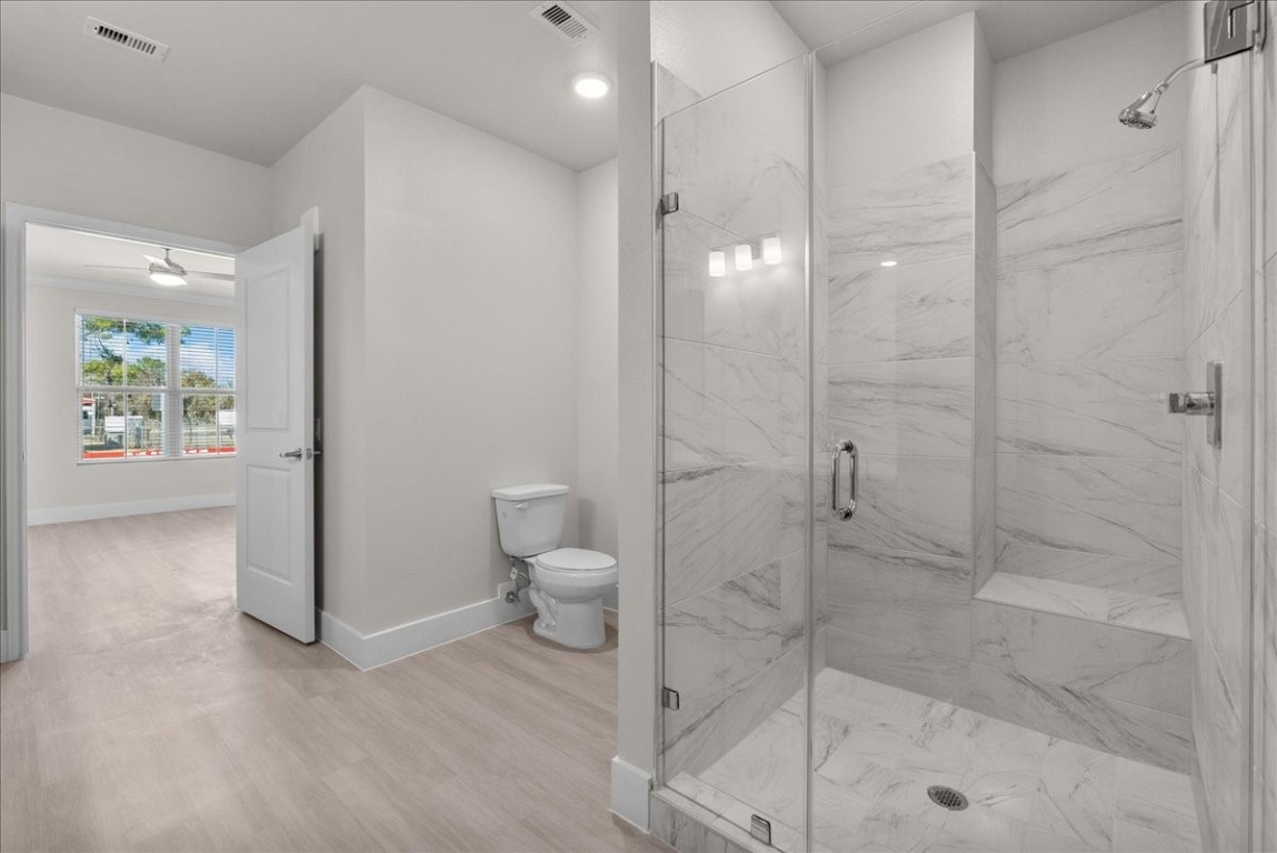 540 Hobbs Road, Unit B1 League City, TX 77573 - Photo 8 of 33 a bathroom with a shower and a toilet
