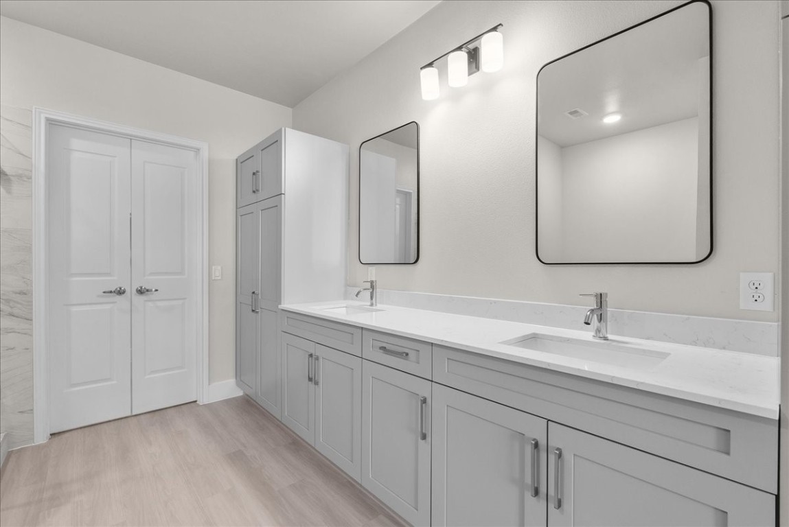 540 Hobbs Road, Unit B1 League City, TX 77573 - Photo 10 of 33 a bathroom with double vanity sinks and a mirror