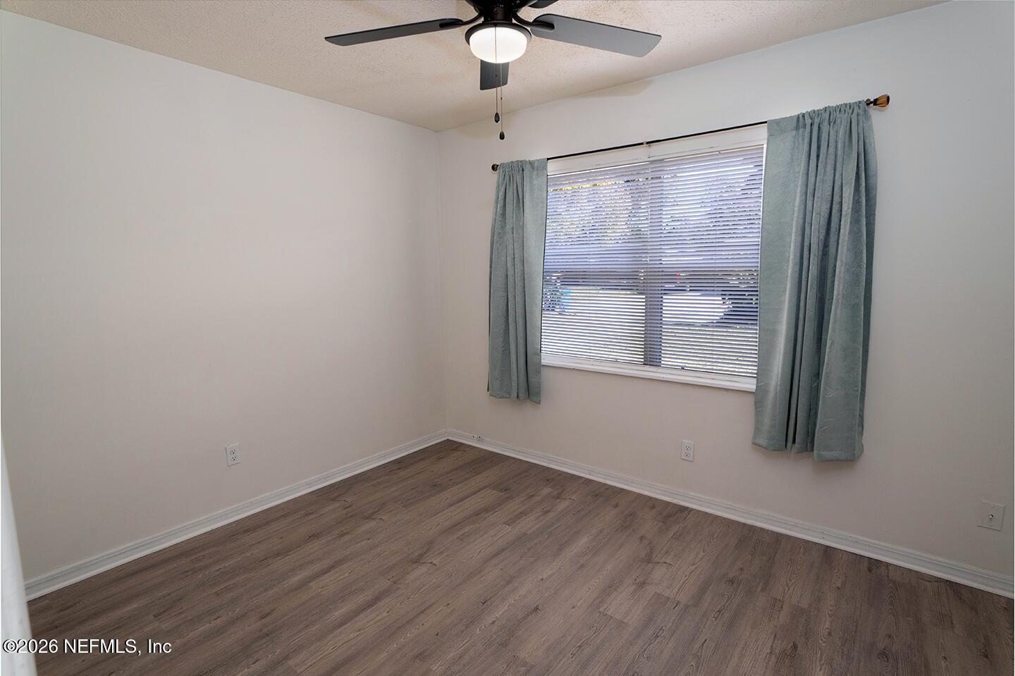 10250 Briarcliff Road East Jacksonville, FL 32218 - Photo 16 of 24 wooden floor in an empty room with a window