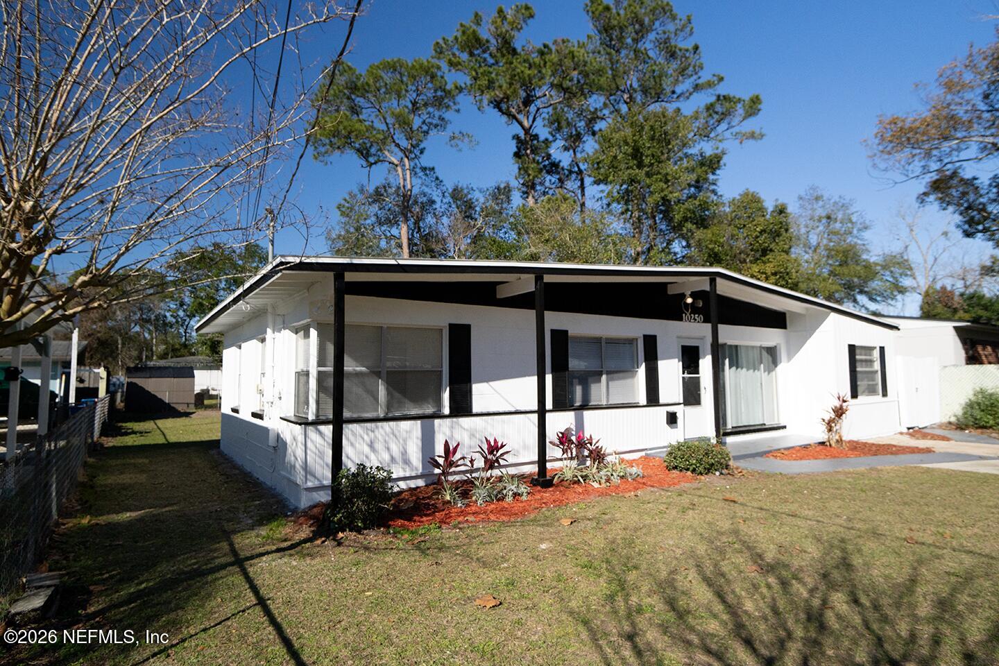 10250 Briarcliff Road East Jacksonville, FL 32218 - Photo 2 of 24 a view of a house with a small yard