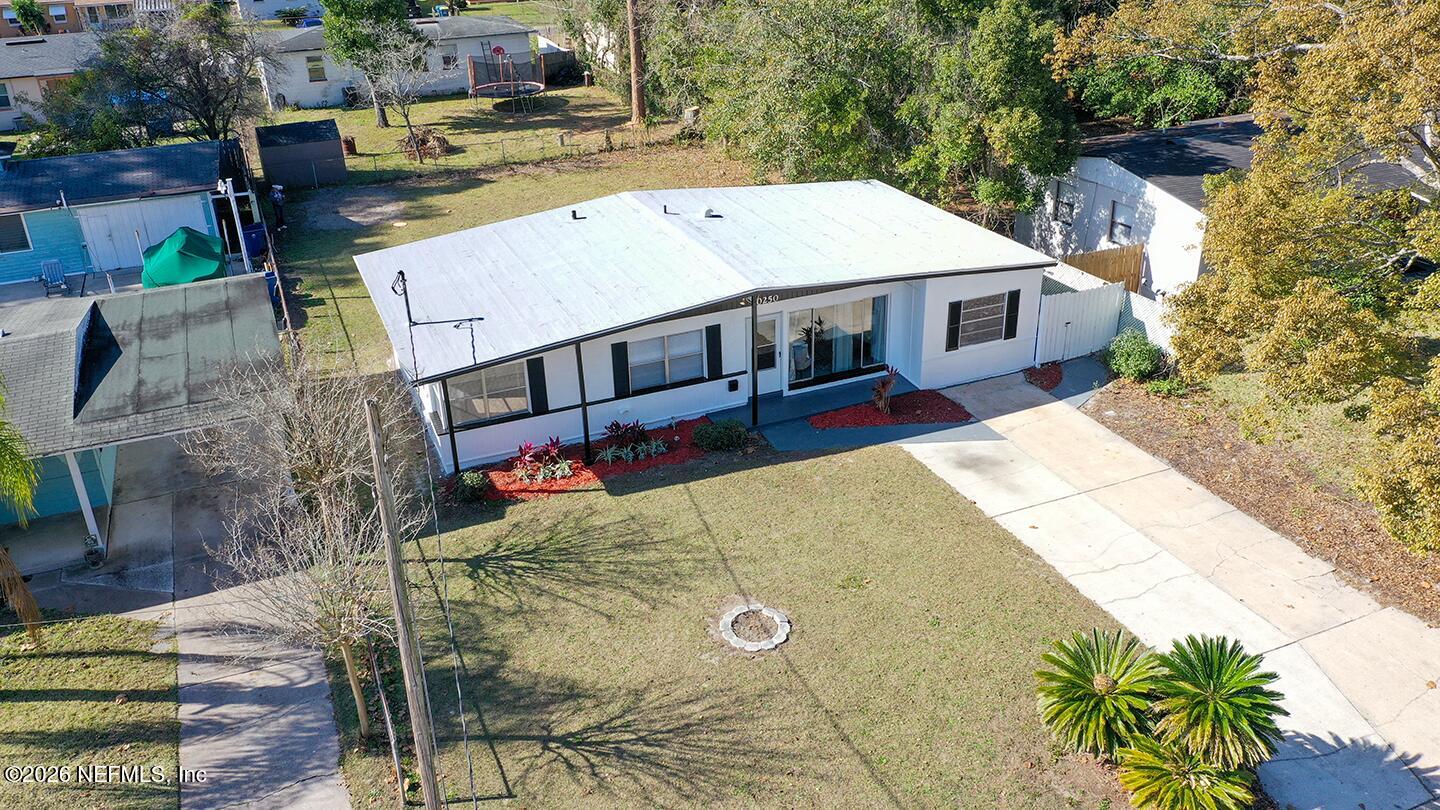 10250 Briarcliff Road East Jacksonville, FL 32218 - Photo 3 of 24 a view of a house with pool and chairs