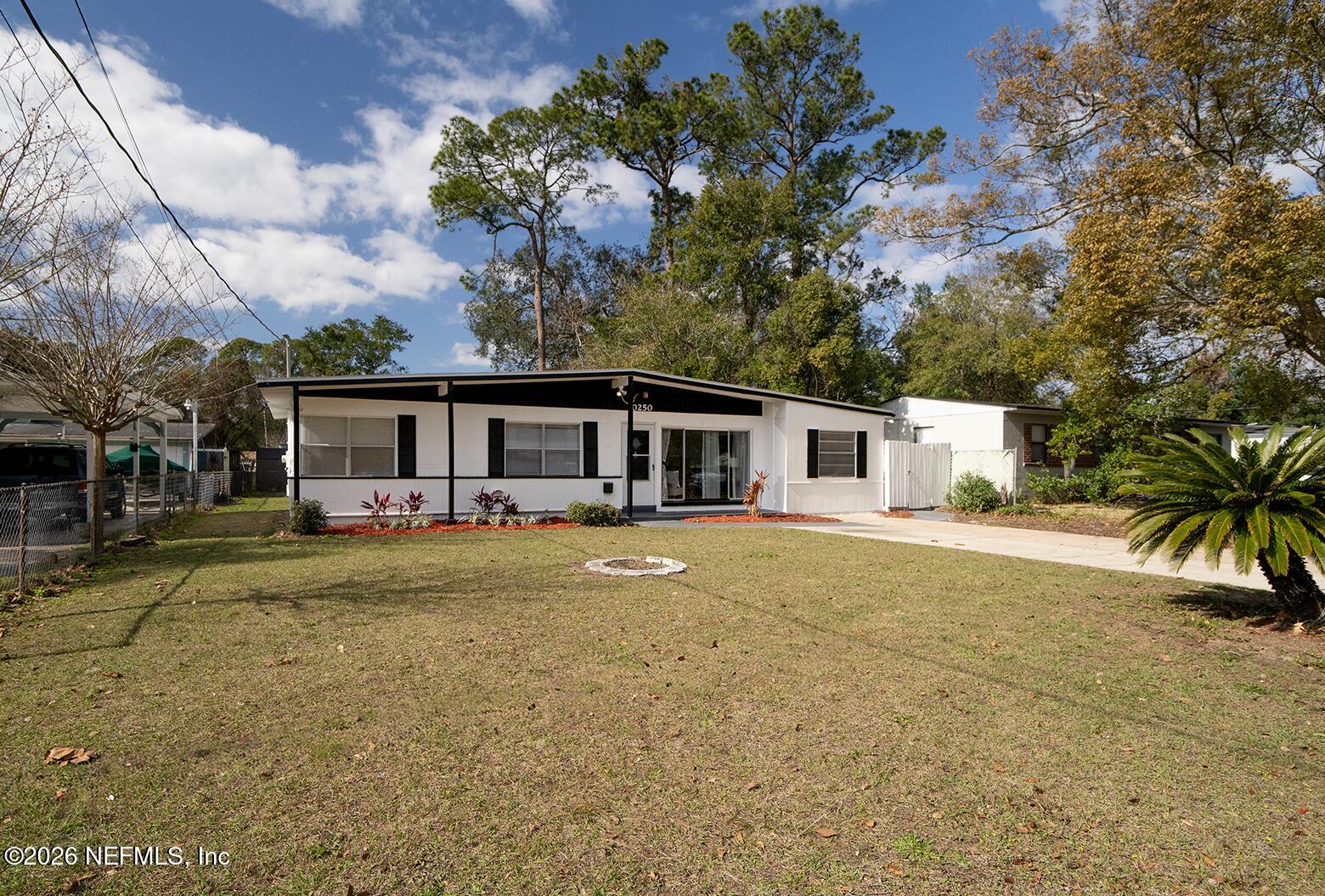 10250 Briarcliff Road East Jacksonville, FL 32218 - Photo 7 of 24 a front view of a house with a yard
