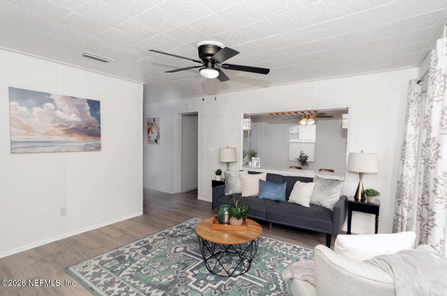 10250 Briarcliff Road East Jacksonville, FL 32218 - Photo 9 of 24 a living room with furniture and a rug